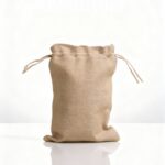 Eco-friendly jewelry tote bag made of natural jute fabric with drawstring closure by Earth Tote – sustainable packaging for UK brands.