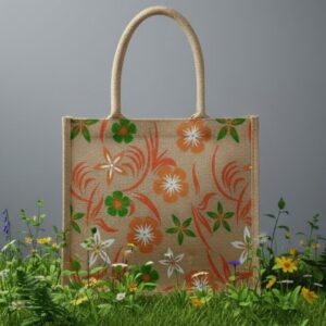 Eco-friendly jute tote bag with colorful floral print and sturdy handles by Earth Tote, displayed on grass with wildflowers